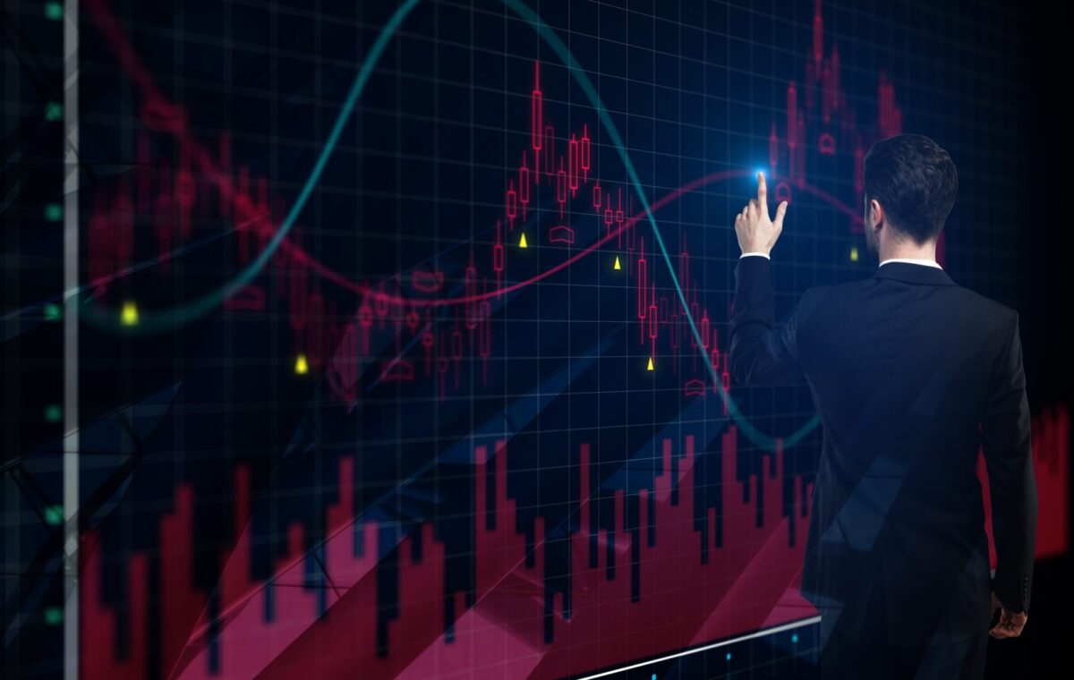 Analyst viewing financial and market charts