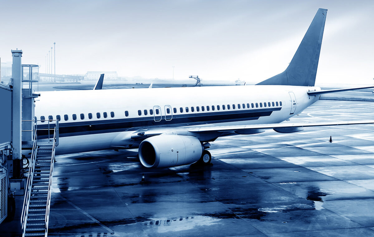 Passenger aircraft parked at a boarding gate